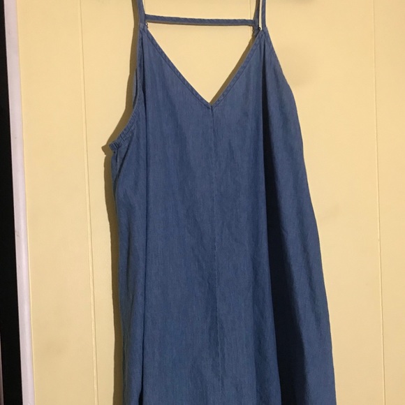 A denim dress with a design on the bottom - Picture 1 of 4